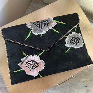 Rebecca Minkoff black with floral clutch.